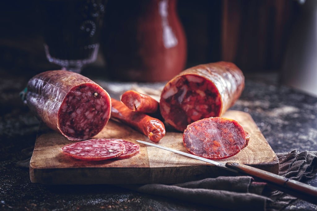 Variation of Spanish Appetizer Salami, Sausage, Ham and Good Quality Cheese on Rustic Background